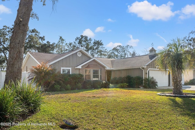 ranch-style home with a garage and a front yard