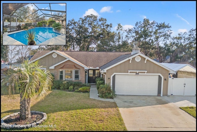 single story home with a garage, a lanai, a fenced in pool, and a front yard