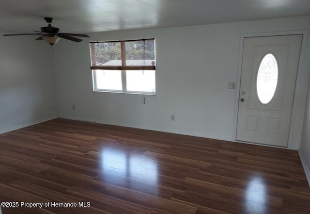 foyer entrance with dark wood-type flooring and ceiling fan