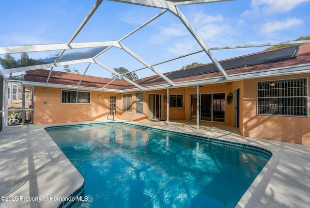 pool featuring a lanai and a patio