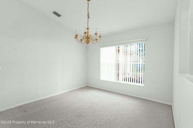 carpeted spare room with a chandelier, visible vents, and baseboards