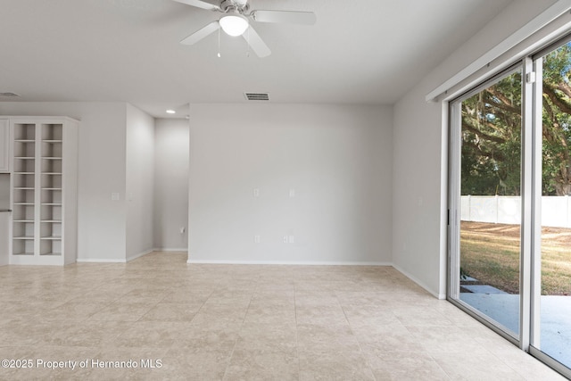 empty room featuring ceiling fan