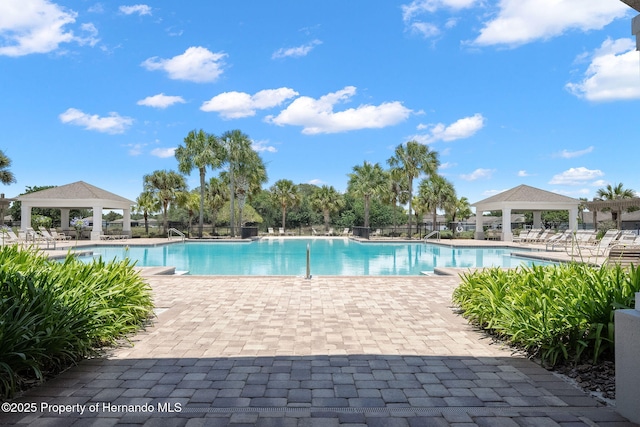 view of swimming pool with a gazebo and a patio area