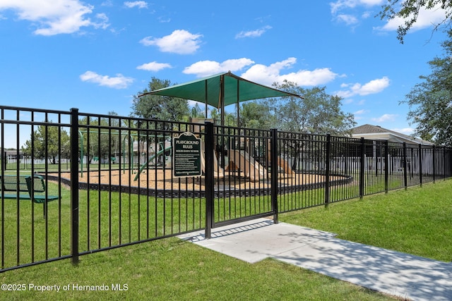 view of gate featuring a lawn