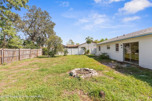 view of yard with an outdoor fire pit