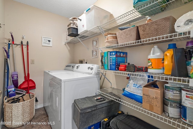 washroom with washing machine and dryer