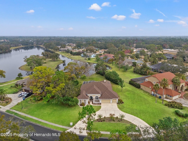 birds eye view of property with a water view