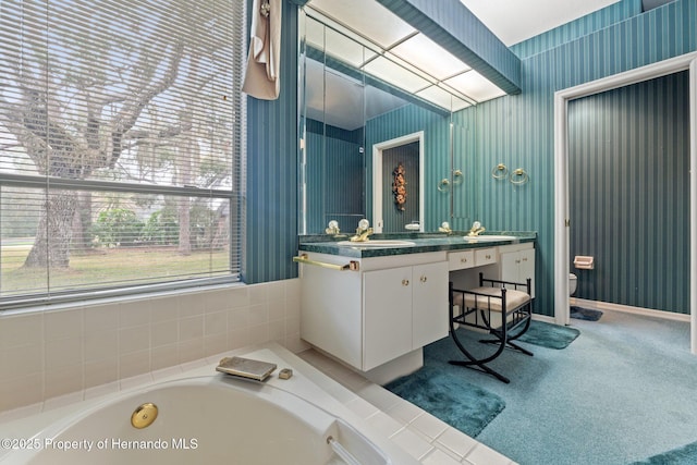 4412 Lake In The Woods Dr, Spring Hill, FL 34607 - bathroom featuring toilet, a garden tub, and vanity