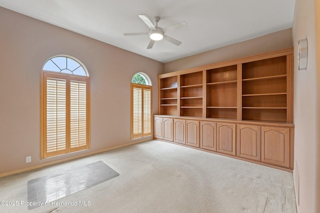 4412 Lake In The Woods Dr, Spring Hill, FL 34607 - carpeted empty room with baseboards and a ceiling fan