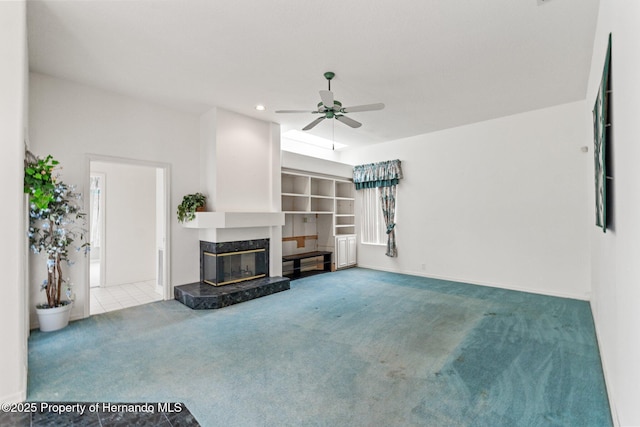 4412 Lake In The Woods Dr, Spring Hill, FL 34607 - unfurnished living room with baseboards, a ceiling fan, carpet, recessed lighting, and a premium fireplace