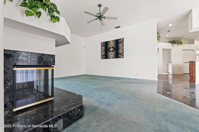 4412 Lake In The Woods Dr, Spring Hill, FL 34607 - unfurnished living room featuring baseboards, recessed lighting, visible vents, ceiling fan, and a high end fireplace