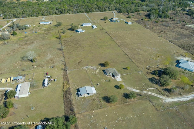 birds eye view of property with a rural view