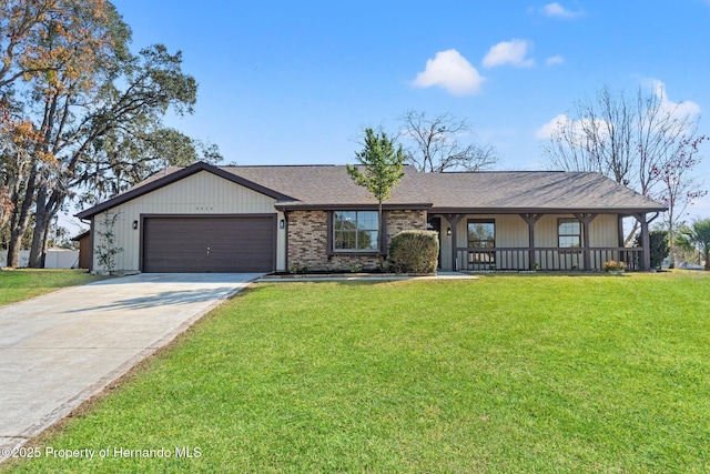 ranch-style home featuring a garage, a front lawn, and covered porch