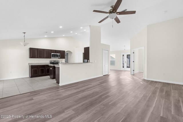 unfurnished living room featuring high vaulted ceiling, ceiling fan, and light hardwood / wood-style floors