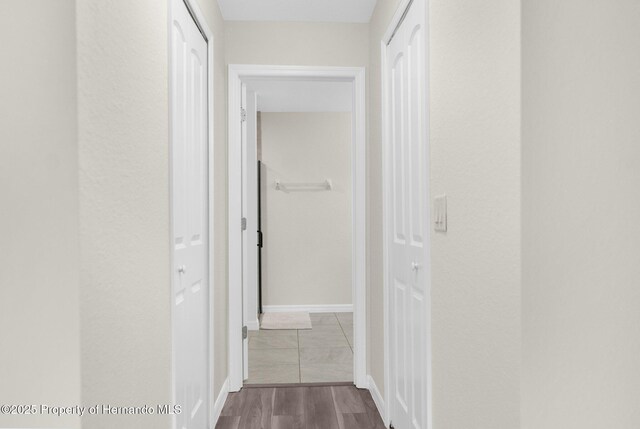 corridor featuring light wood-type flooring