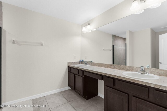 bathroom featuring walk in shower, tile patterned floors, and vanity