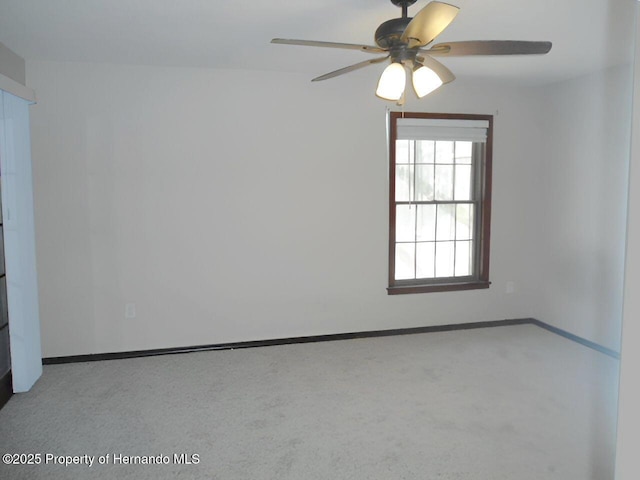 unfurnished room featuring ceiling fan