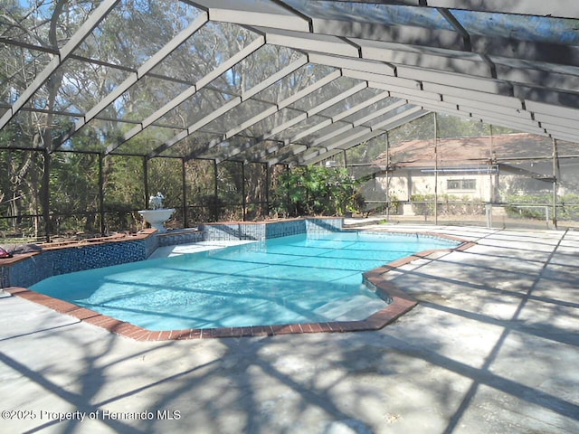 view of pool featuring a lanai and a patio area