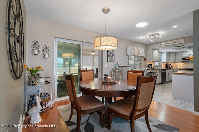 dining area with light hardwood / wood-style floors