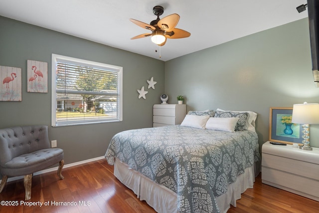 bedroom featuring hardwood / wood-style flooring and ceiling fan