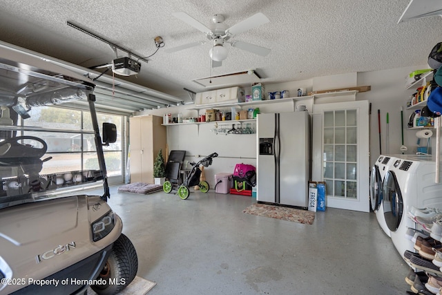 garage with a garage door opener, washing machine and clothes dryer, ceiling fan, and stainless steel fridge with ice dispenser