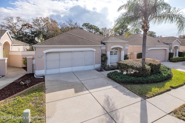 view of front of property with a garage