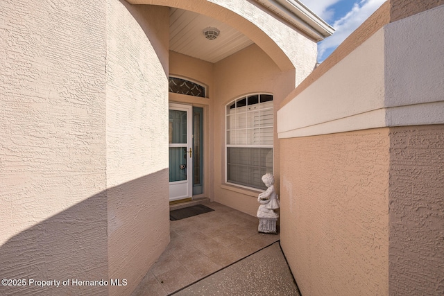 property entrance with a patio area