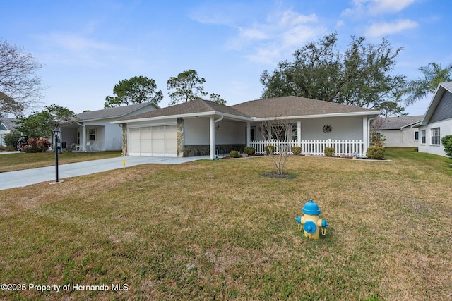 single story home with a porch, a garage, and a front lawn