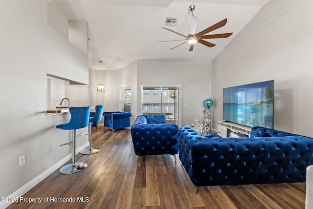 living room featuring vaulted ceiling, hardwood / wood-style floors, and ceiling fan