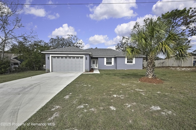 view of front of house featuring a garage and a front lawn