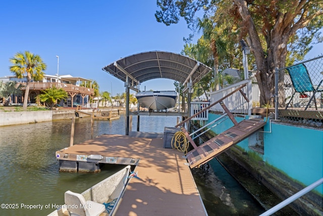 dock area with a water view