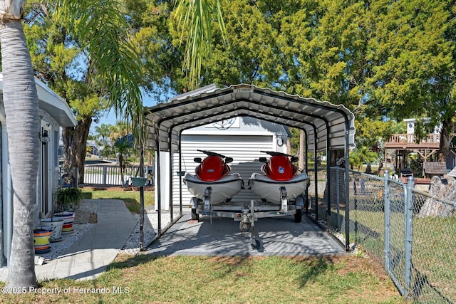 view of vehicle parking with a carport