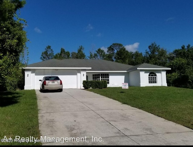 ranch-style house with a garage and a front lawn