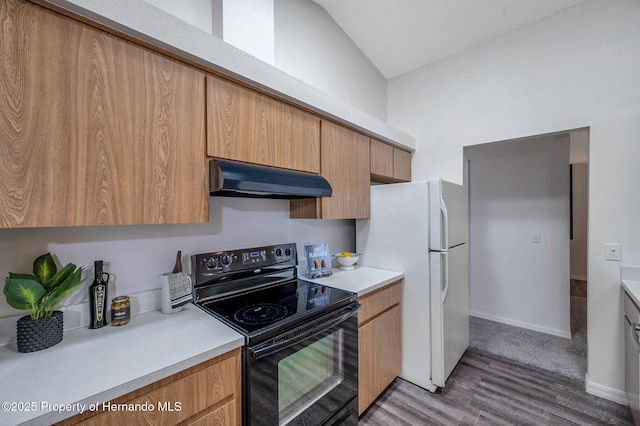 kitchen featuring vaulted ceiling, wood-type flooring, white refrigerator, exhaust hood, and black range with electric stovetop