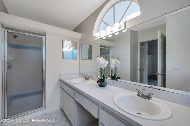 bathroom with vanity, an enclosed shower, and lofted ceiling