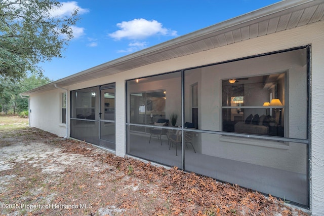 back of house with a sunroom