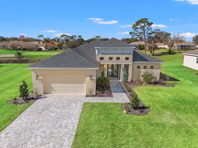 view of front facade with a garage and a front yard