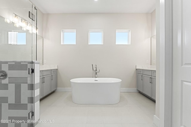 bathroom featuring vanity and shower with separate bathtub