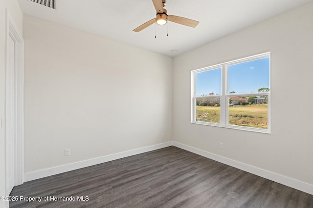 unfurnished room featuring ceiling fan and dark hardwood / wood-style floors