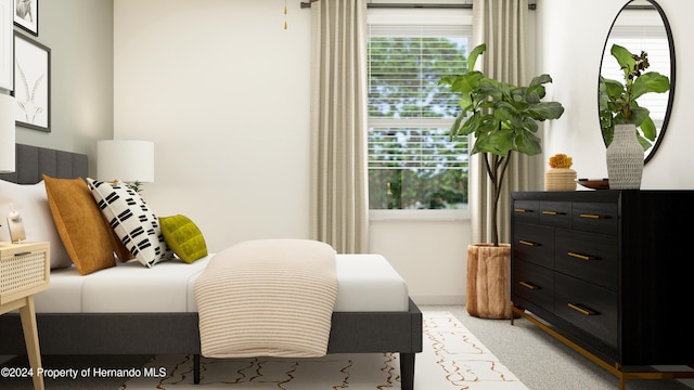 bedroom featuring light colored carpet