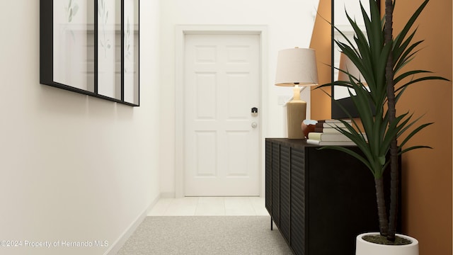 hall featuring light tile patterned flooring