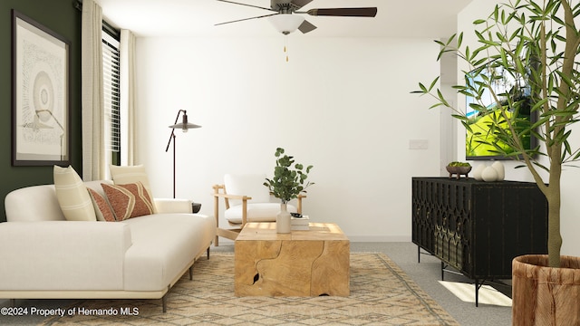 living area with ceiling fan and light carpet