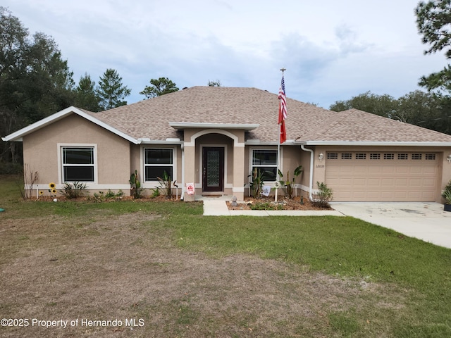 single story home featuring a front lawn, roof with shingles, an attached garage, and stucco siding