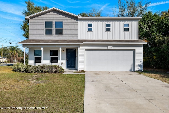 front of property with a garage and a front yard