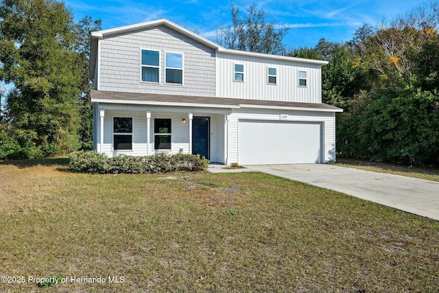 view of front property featuring a garage and a front lawn