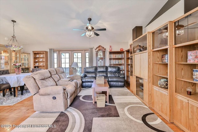 living room with french doors, ceiling fan, and light parquet floors