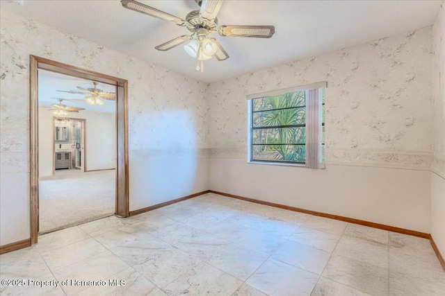 spare room featuring ceiling fan