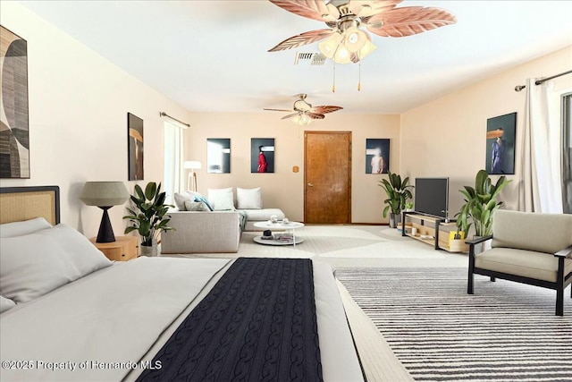 bedroom featuring ceiling fan and light carpet