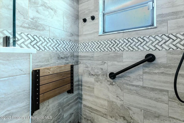 bathroom with tiled shower