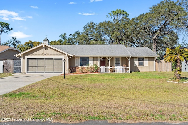 single story home with a garage, a porch, and a front yard